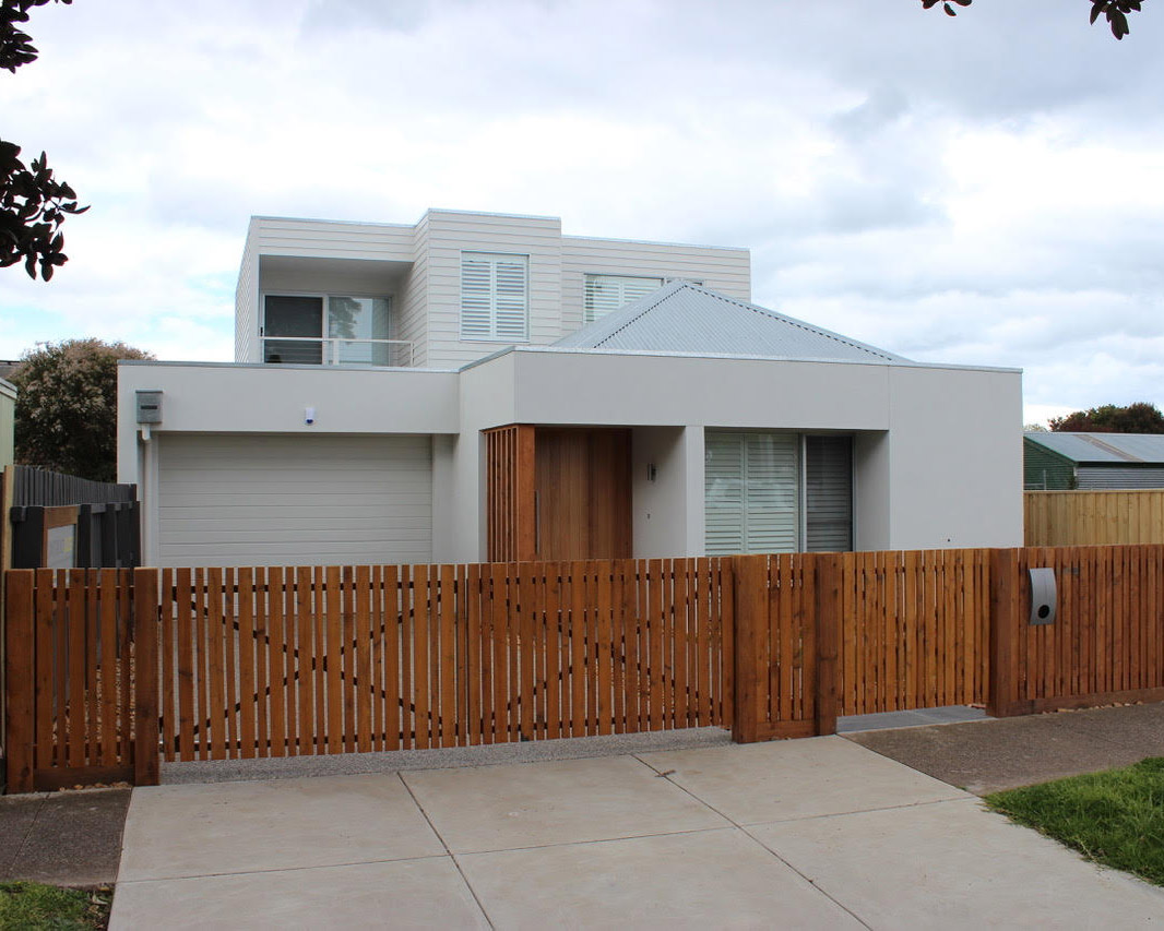 Contemporary two storey home with timber fencing